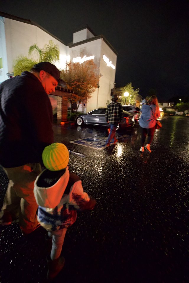 Halloween Night Trick-or-Treating in Rainy Neighborhood