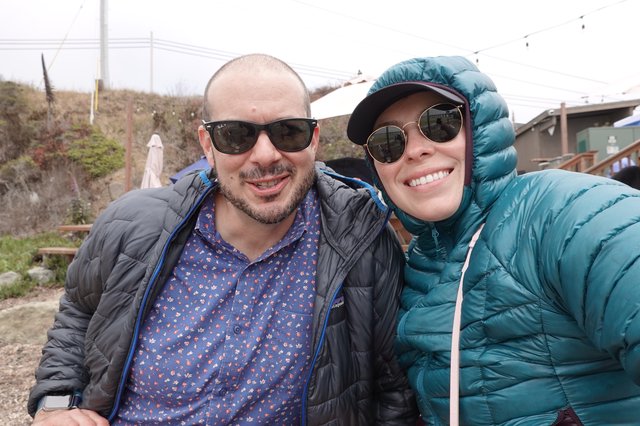 Couple in Puffy Jackets Enjoying Outdoor Adventure