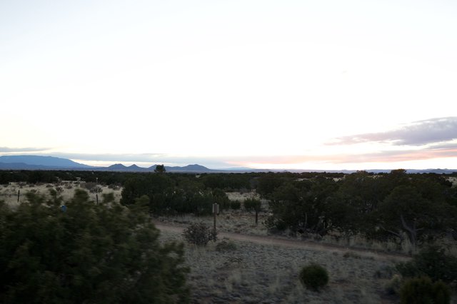 Desert Twilight Over Distant Mountain Ranges
