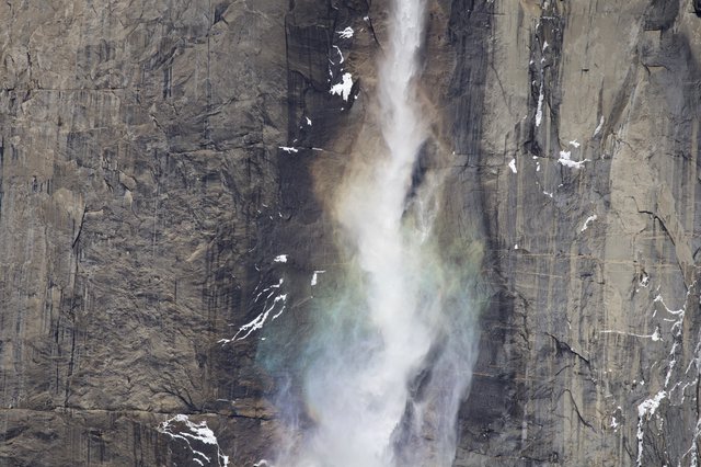 Powerful Waterfall Cascading Down Yosemite's Granite Cliff Face