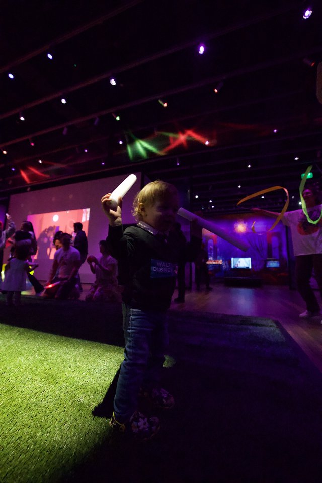 Child Wielding Glow Stick at Baby Rave Dance Party