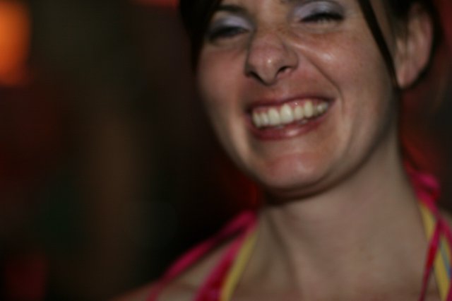 Joyful Woman Laughing at a Nighttime Event