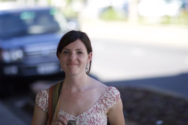 Woman Smiling Outdoors in Floral Summer Dress