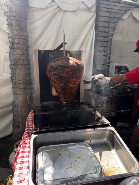 Mastering the Art of Grilling: Man Cooks Massive Burrito on Rotisserie