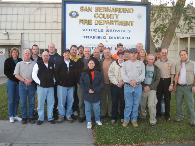 Group of 22 Poses in Front of ICS 300 Sign