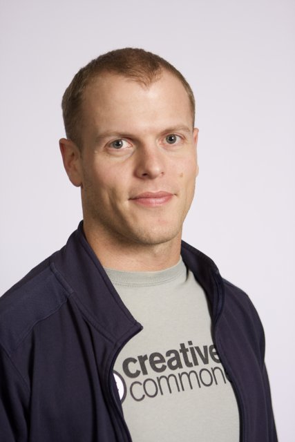 Timothy Ferriss in a Blue Jacket and White Shirt