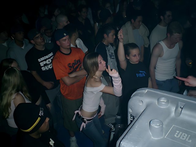 White Tank Top in a Nightclub Crowd