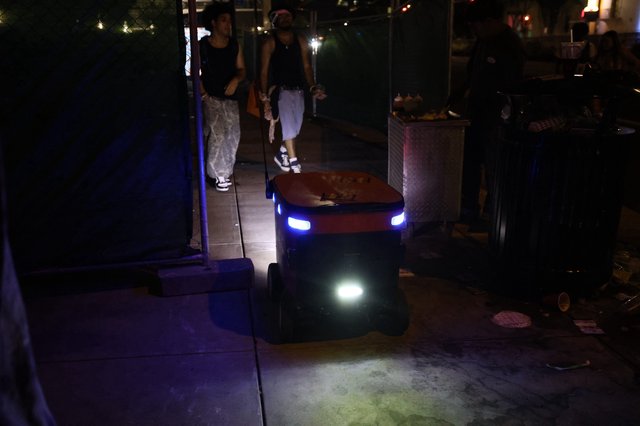Autonomous Delivery Robot Navigates Nighttime Festival Crowd