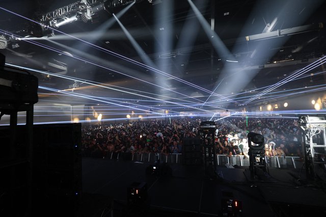 Laser Light Storm Over Massive Dance Music Crowd