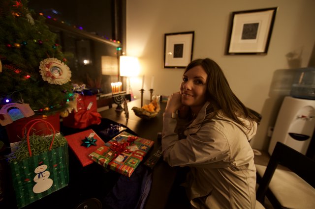 Smiling Woman Celebrates Hanukkah and Christmas Together