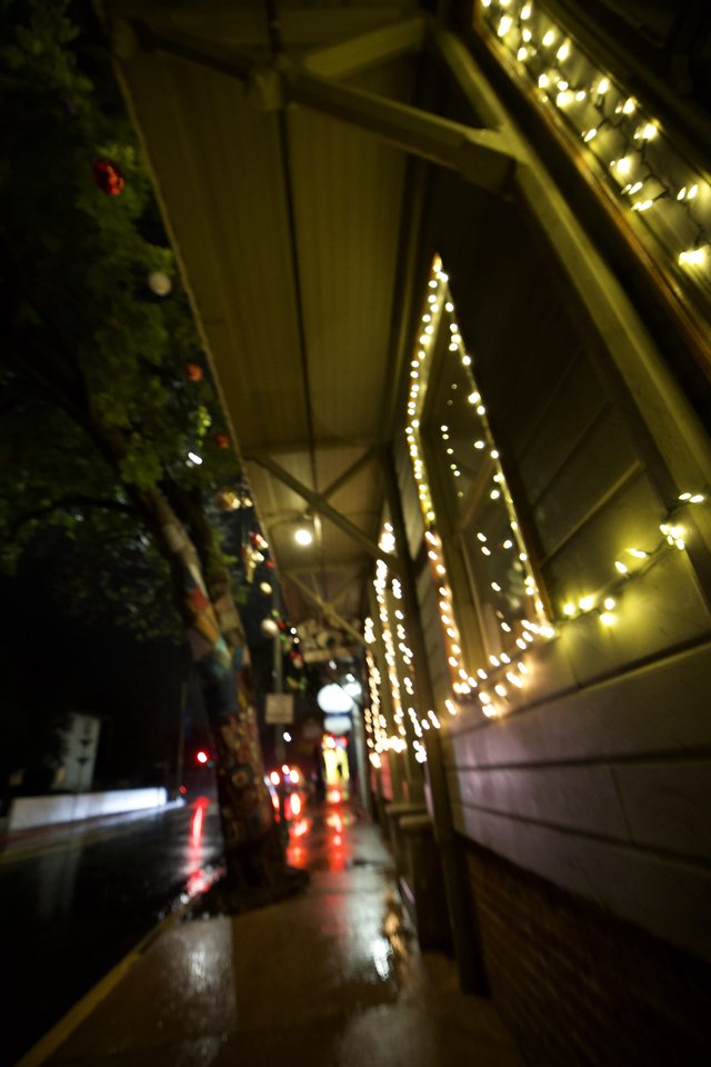 Festive Night Street Scene with Holiday Lights