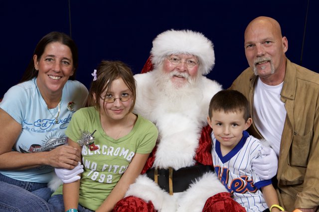 A Heartwarming Christmas Moment with Santa and the Family