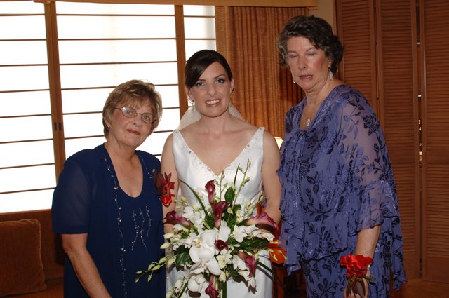 Bride Poses with Two Women on Wedding Day