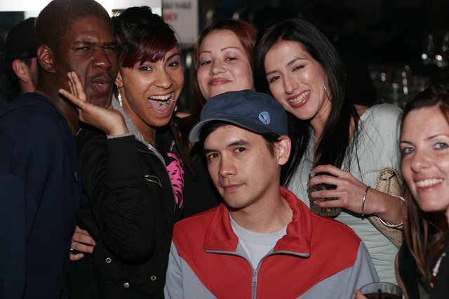 Friends Laughing Together at a Night Venue