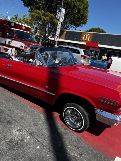 Red Convertible Riding in Style