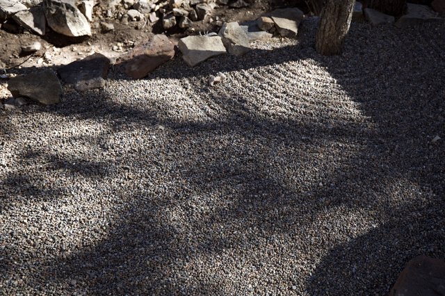 Sunlit Pebble Mosaic with Ancient Stone Ruins