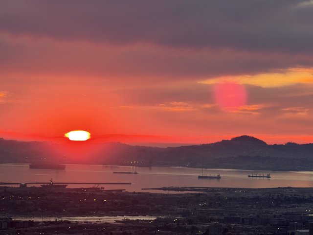 Golden Sunset Over San Francisco Bay with Cargo Ships