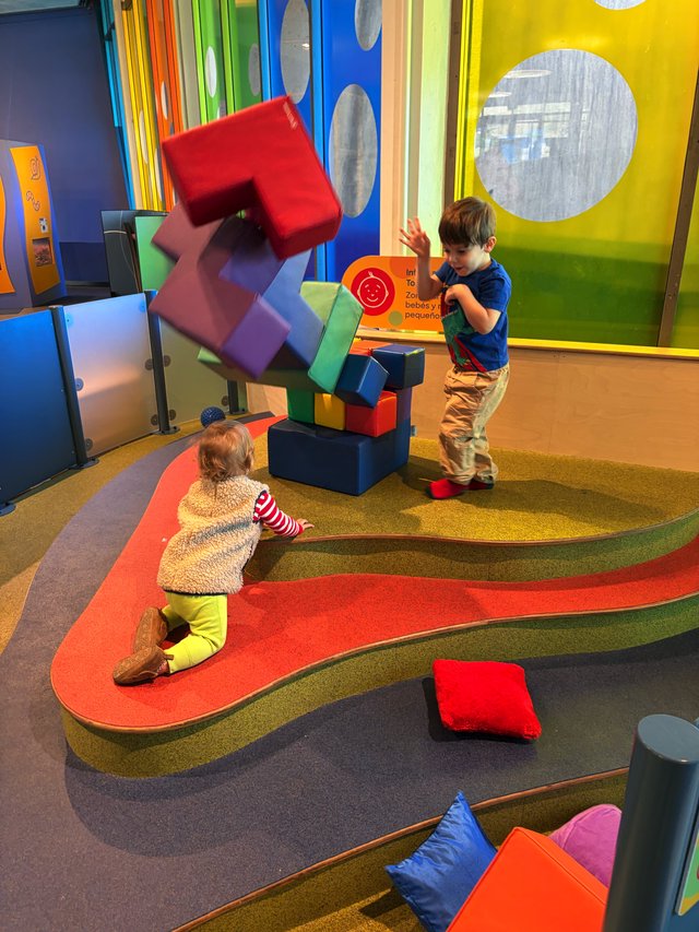 Children Playing with Colorful Building Blocks at Interactive Museum