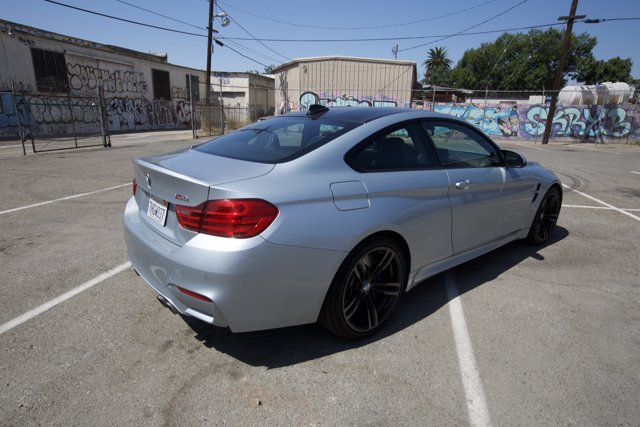 Sporty BMW M4 Coupe in a Graffiti Parking Lot