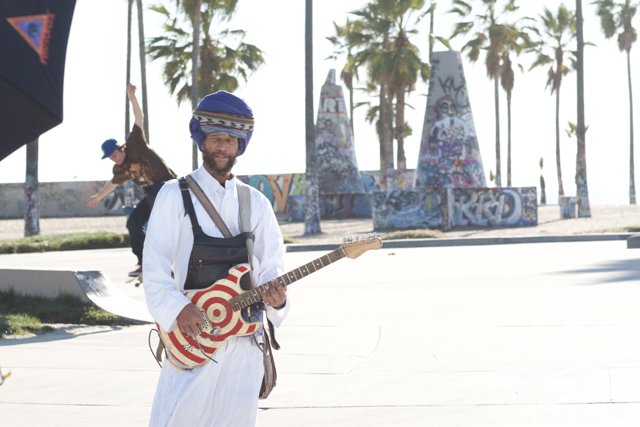 Musician in Turban Strums a Groove