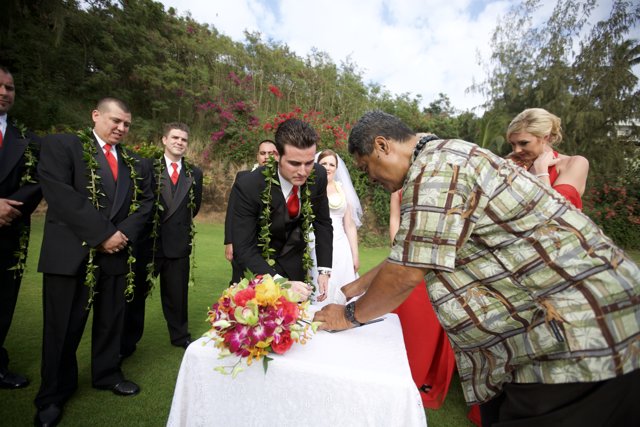 Wedding ceremony with the groom signing the certificate