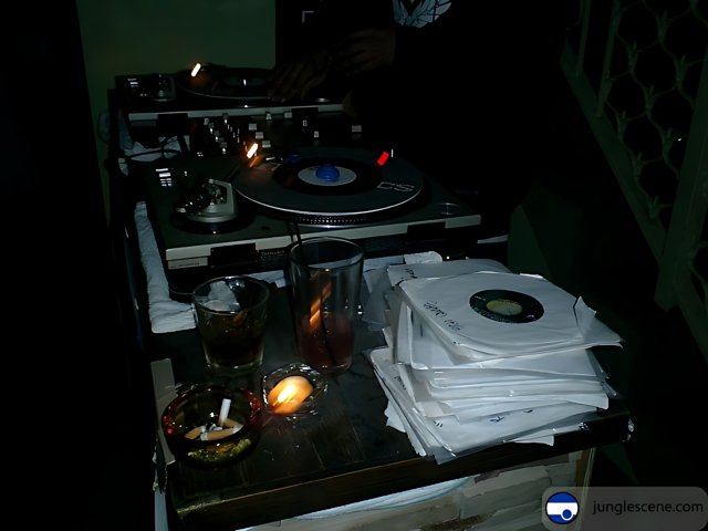 DJ spinning records by candlelight