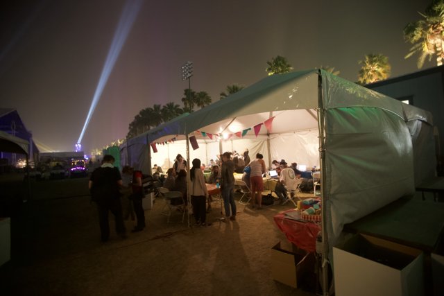 Nighttime Gathering at the Coachella Tent