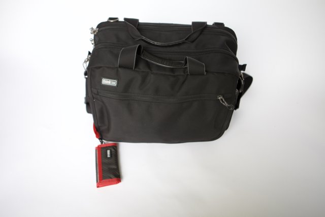 Sleek Black Backpack with Striking Red Straps