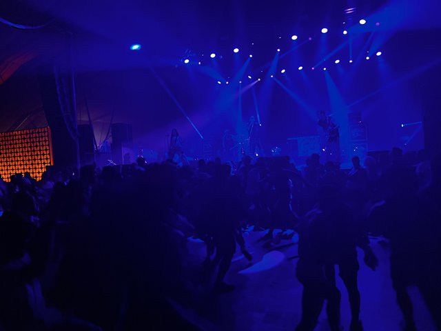 Blue-Lit Concert Crowd at Empire Polo Club