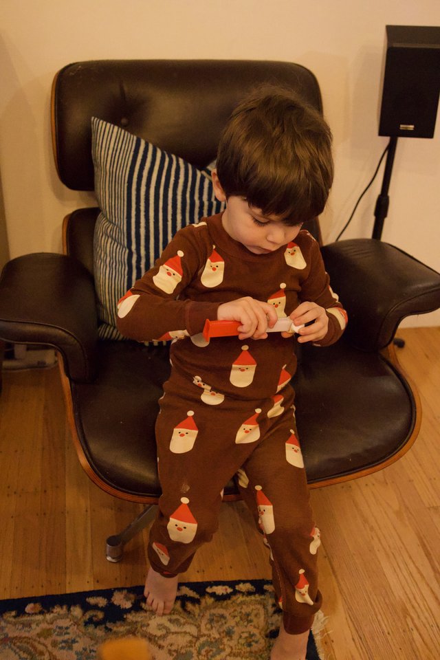 Young Child Playing with Toys on Christmas Day