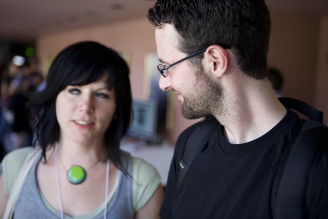 An Eyeglass-Wearing Couple Engage in Conversation