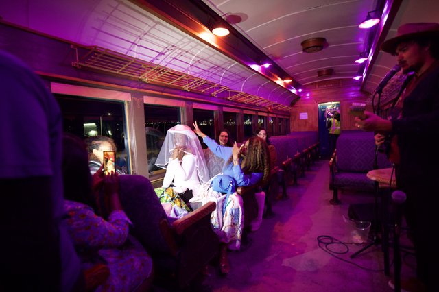 Bride Celebration on Vintage Purple-Lit Train Car