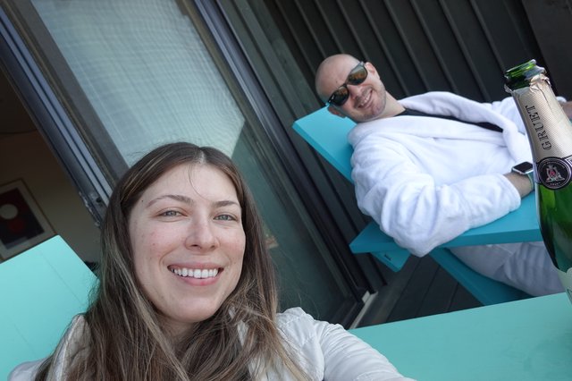 Couple Celebrating with Champagne by Pool