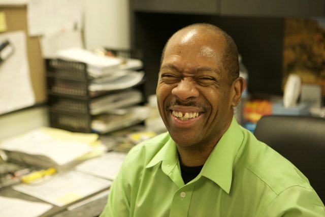Happy Black Man at His Desk