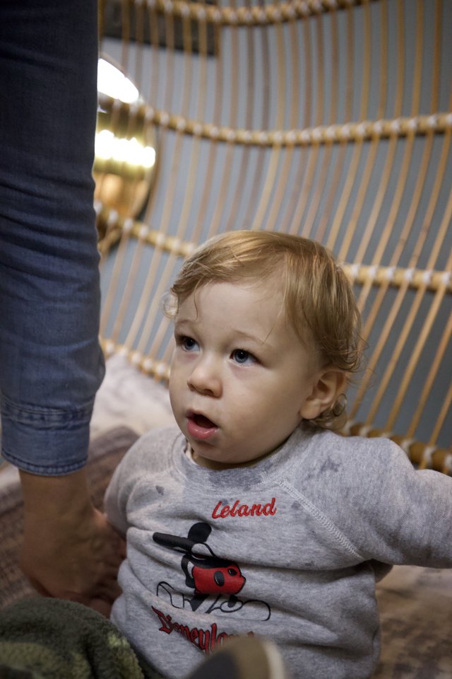 Toddler in Mickey Mouse Shirt at Indoor Venue