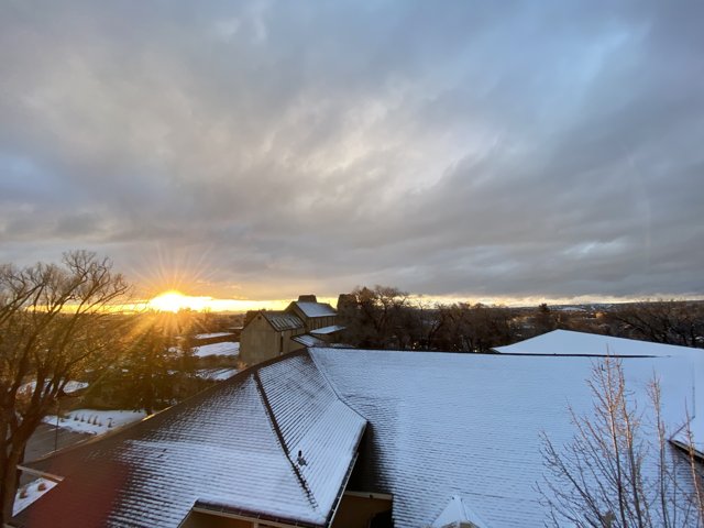 Winter Sunset on a Snowy Roof