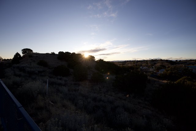 Sunset Over Rolling Hills and Rural Valley