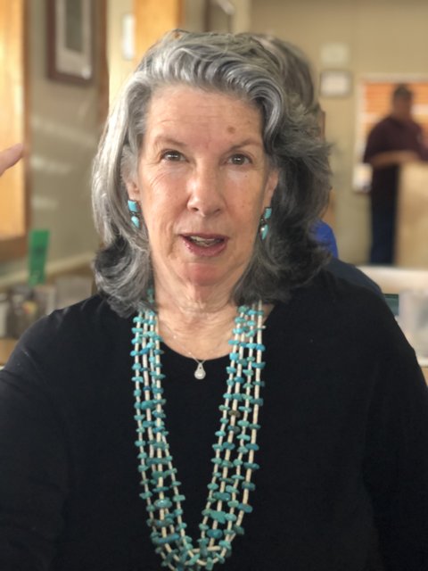 Portrait of Rhoda B wearing a Gray Necklace