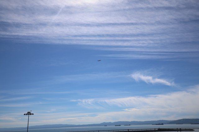 Aircraft Departing Over Bay at Dusk from USS Hornet
