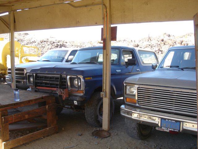 Blue Pickup Truck Under Wooden Structure