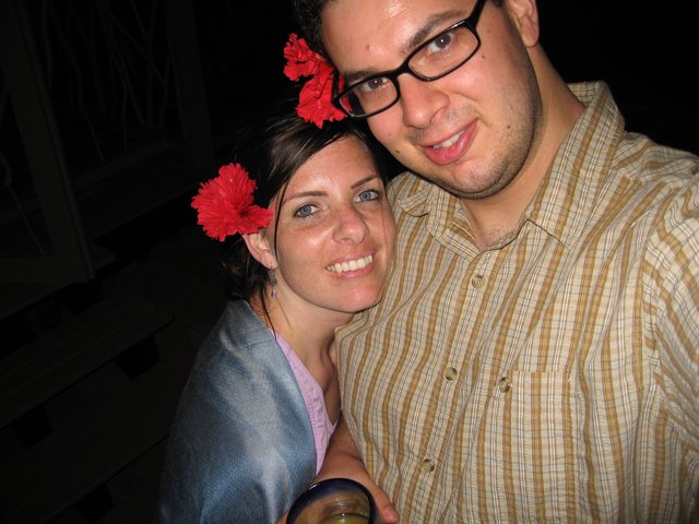 Couple Smiling Together at a Tropical Evening Event