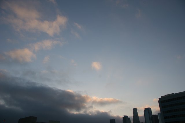 Cloudy Sunset Silhouette of Skyscrapers