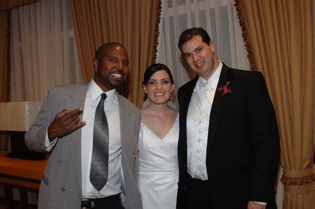 Joyful Wedding Celebration with Bride, Groom, and Guest