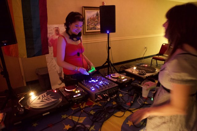 Women and DJ playing music