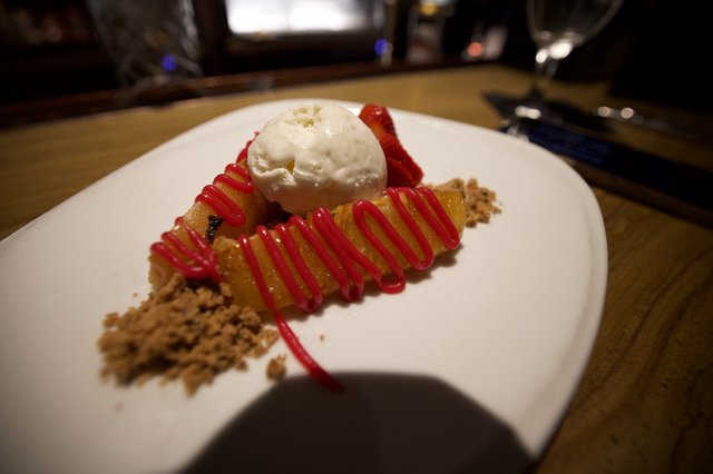 Gourmet Dessert Plate with Vanilla Ice Cream and Berry Drizzle