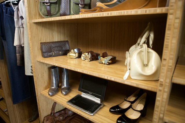 Wooden Closet with Handbags, Shoes, and Laptop