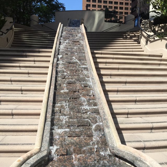 Modern Oasis: Waterfall on Building Stairs