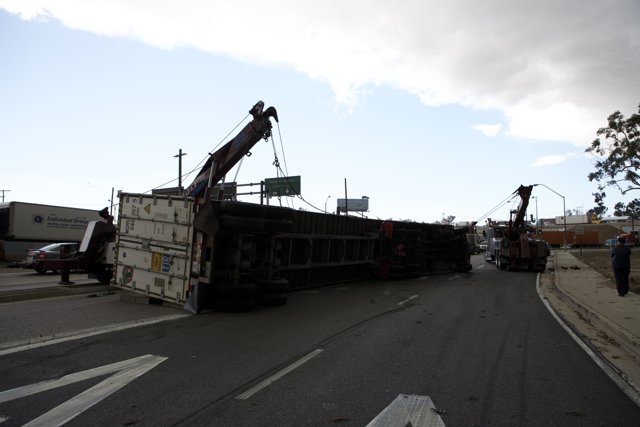 Rescue Mission: Crane Lifts Overturned Truck Off Roadway