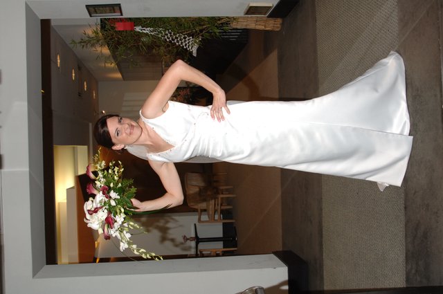 Radiant Bride Poses with Bouquet in Elegant Venue