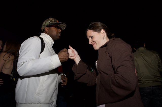 Fist Bump Connection at Night Outdoor Event